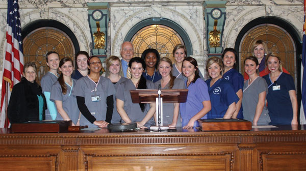 Dental hygiene students visit with state senators Debbie Dawkins, left, and Tommy Gollott, center, during a tour of the Mississippi Capitol Jan. 13.